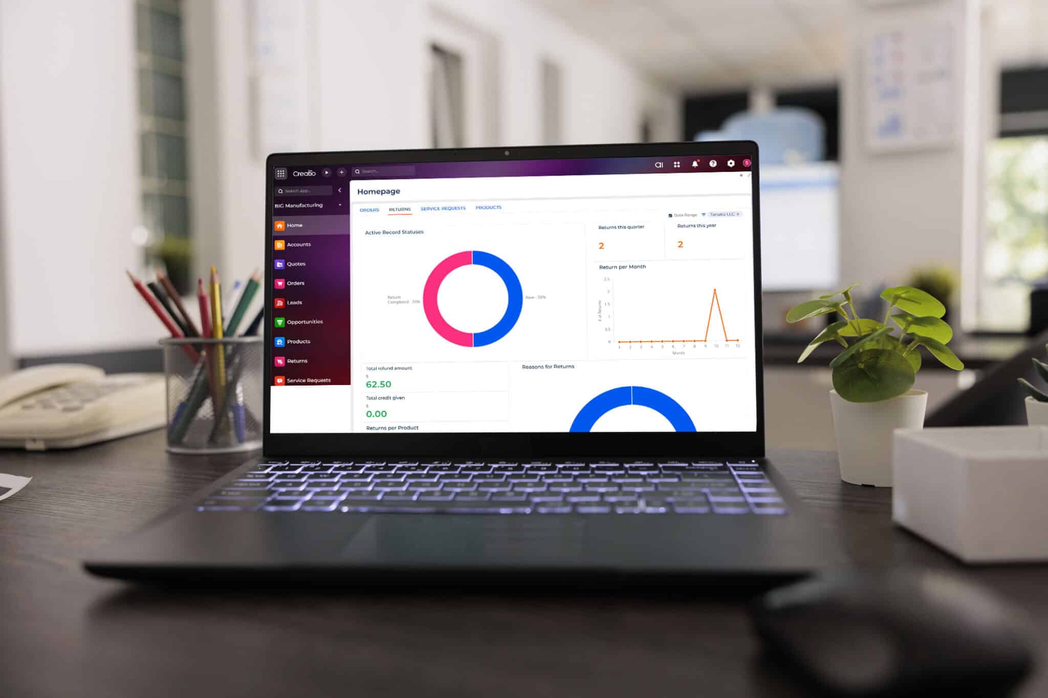 Close up view of laptop display with leading financial data software in a investment trading company. Empty workstation in the morning with plant and work equipment on desk.
